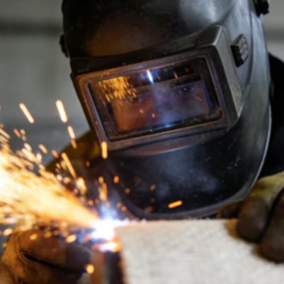 Silicone coated fiberglass welding blanket for industrial spark protection